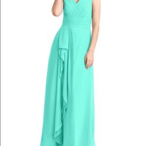 Three dresses.  Two turquoise and one Spa color